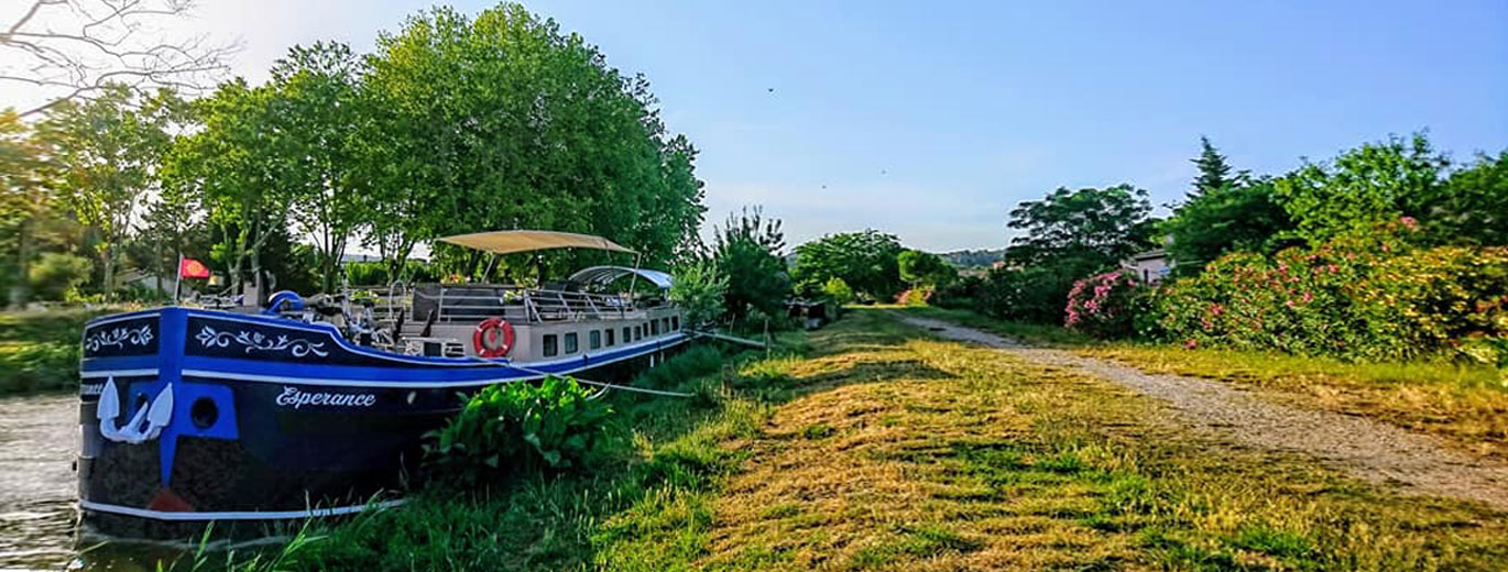 Barge Esperance moored on the Canal du Midi